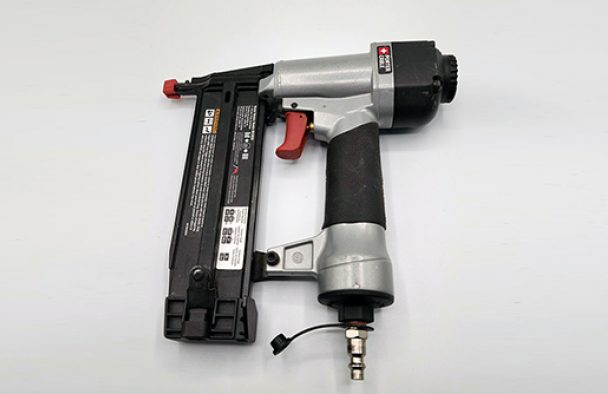 a handheld nail gun.